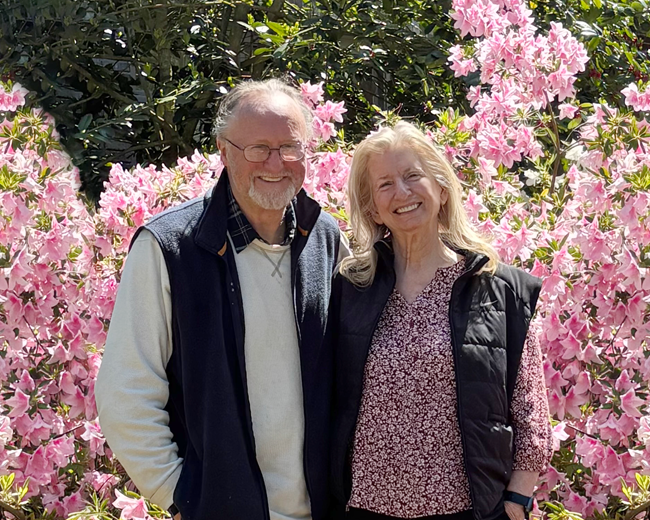 Southworth and Brown in front of flowers