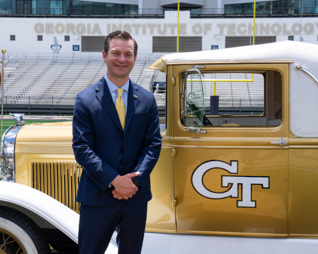 Photo of Ryan Alpert with the Ramblin' Wreck.