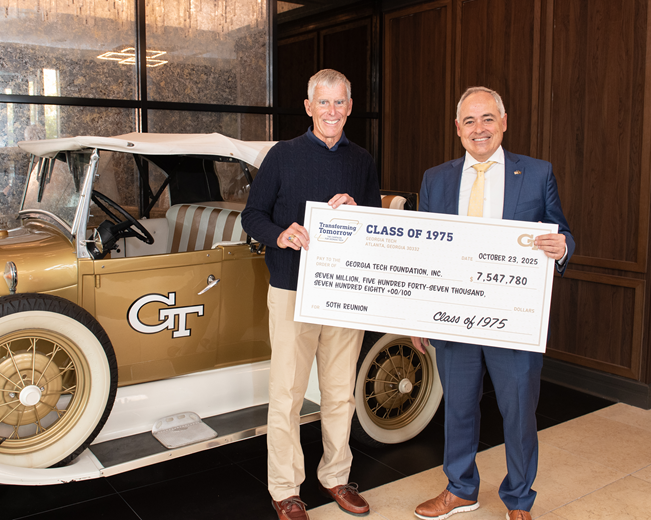 president Cabrera with alumnus presenting reunion philanthropy check