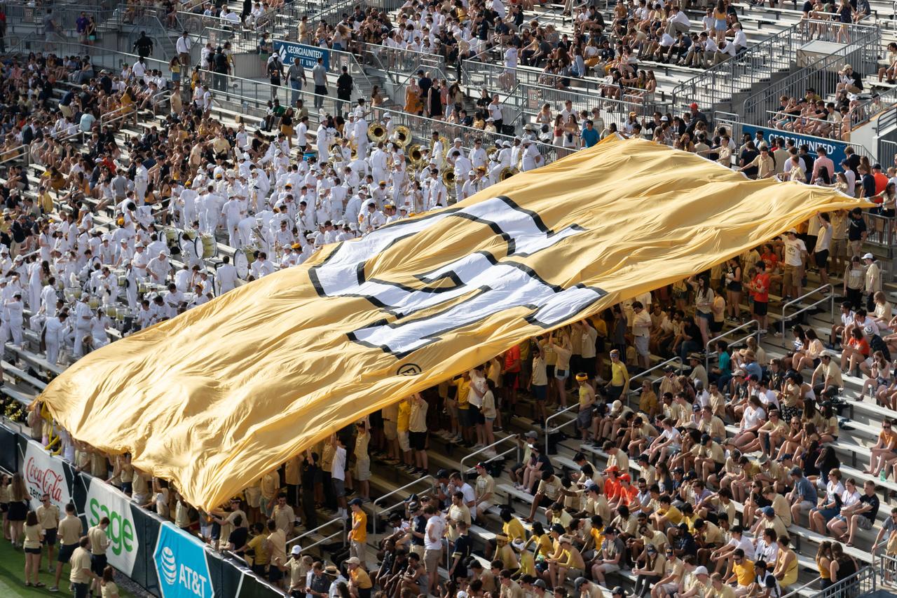stadium with fans and GT flag