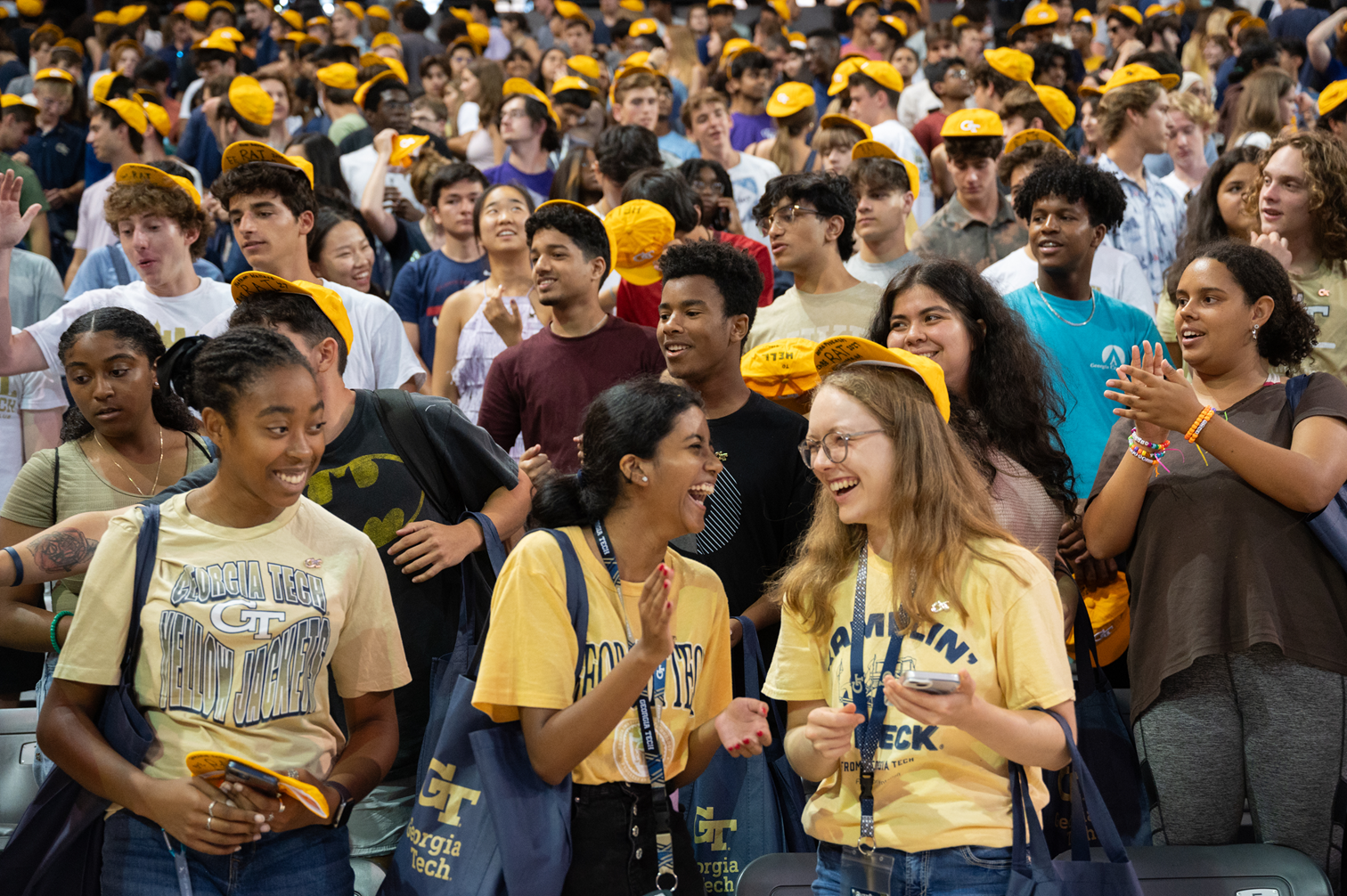 students in yellow RAT caps