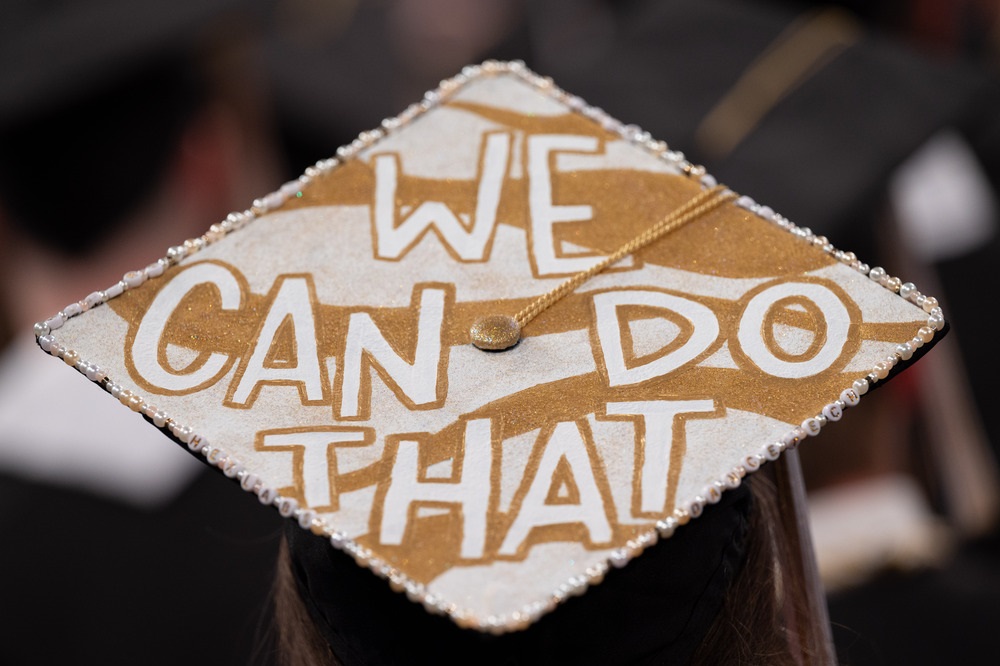 graduation cap saying "we can do that"