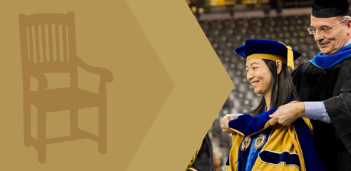 A chair symbol with a graduate being hooded